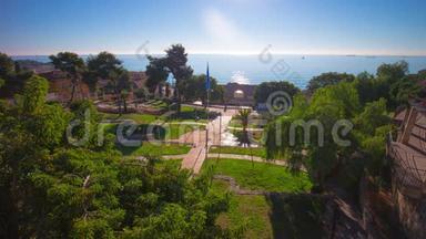 西班牙太阳光天化日的圆形剧场花园和海洋全景4k延时